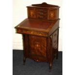 An Edwardian rosewood, boxwood inlaid and strung Davenport desk. The upstand with three drawers