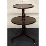 A Geo III mahogany two tier dish topped dumb-waiter with inverted sabre supports. 86cm high