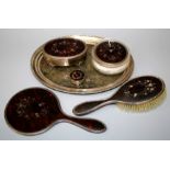 Mappin and Webb, a silver, tortoiseshell set dressing table suite, comprising ring box, mirror,