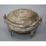 An old Chinese terracotta  tripod Ding and cover with remains of rudimentary poly-chromatic