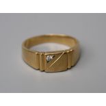 A Gentleman's French diamond set signet ring, the rectangular central panel with an off-set diamond,