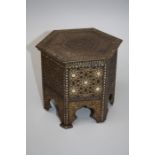An early 20th century Huntley and Palmers biscuit tin in the form of a Moorish hexagonal table. 16.5