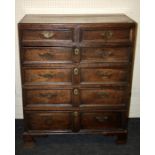 An early 18th century oak chest, the caddy top over two short and four graduated long drawers with
