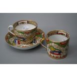 A mid 19th Century English porcelain tea cup and saucer, decorated in the Chinese manner with