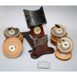 An Edwardian Kinora viewer with japanned hood, hand cranked mechanism on a mahogany stained base,