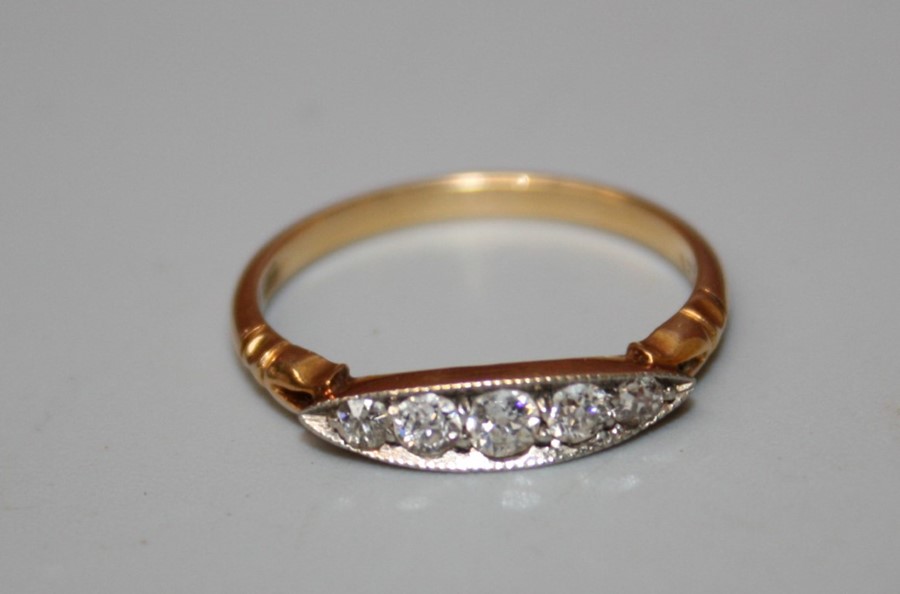 .A five stone half hoop diamond ring, the graduated old brilliant cut diamonds, in navette shaped