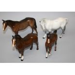 Three brown gloss glazed Beswick horses, together with a Beswick grey horse (a/f).