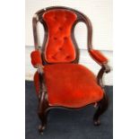 A Victorian, serpentine backed mahogany parlour open armchair  with button upholstery  and raised on