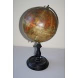 An early 20th century "Geographica"  8" terrestrial table globe. Raised on a turned and ebonised
