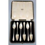 Roberts and Dore, a cased set of six silver grapefruit spoons with lappet detail to terminals.
