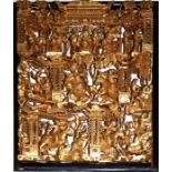 A Chinese hook carved gilt wood panel. Decorated with tiers of actors playing their parts. 45 x 33