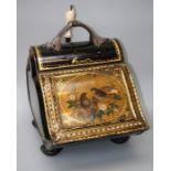 A Victorian toleware coal scuttle of ogee shape, the sloping hinged cover decorated with