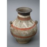 A Chinese Han style pottery funerary wine jar with polychromatic zoned decoration and simple lug