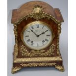 A late 19th or early 20th century gilt brass mounted walnut mantle clock, the eight day movement