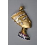 An Egyptian gem set pendant, the pharaoh's bust profile set with bands of daimonds, rubies and