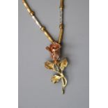 An Italian three colour yellow metal fancy link chain and cast rose pendant, marked 14k. Chain 46.