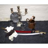 A reproduction Indian cavalry sword with brass lion's mask pommel, a copper water can, two pewter
