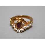 An Italian 18ct dress ring set central oval cut pink stone and seven cubic zirconia. Approx. 5g
