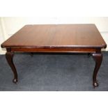 An early 20th mahogany , wind-out dining table raised on cabriole supports. 149cm long