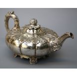 James Fray, a silver compressed melon form teapot. The cover with bud finial. the body and spout