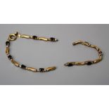 A sapphire line bracelet, the oval cut sapphires in two tone links,19cm length CONDITION:one of