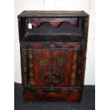 A probably 19th century Tibetan wooden, Buddhist altar cupboard painted with a wrathful deity's