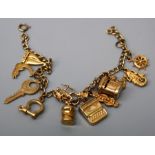 A charm bracelet, the cable link chain suspending twelve charms including a post box and various