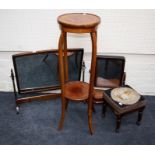 An Edwardian inlaid mahogany circular, pedestal jardiniere stand with under tier and splay supports.