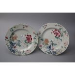 A pair of Chinese famille rose plates, Qianlong. Each decorated with peonies and lotus blossom. 23