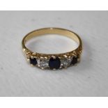 A five stone half hoop sapphire and diamond ring, the graduated mixed oval and old brilliant cut