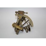 A brass sextant by Henry Barrow & Co. London.