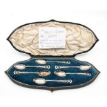 A cased set of Edwardian William Comyns silver Art Nouveau teaspoons, tendril design finials, London