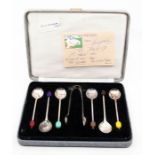 A cased set of EPNS coffee spoons and sugar tongs, gifted to Marjorie Dawson by HM Queen Elizabeth