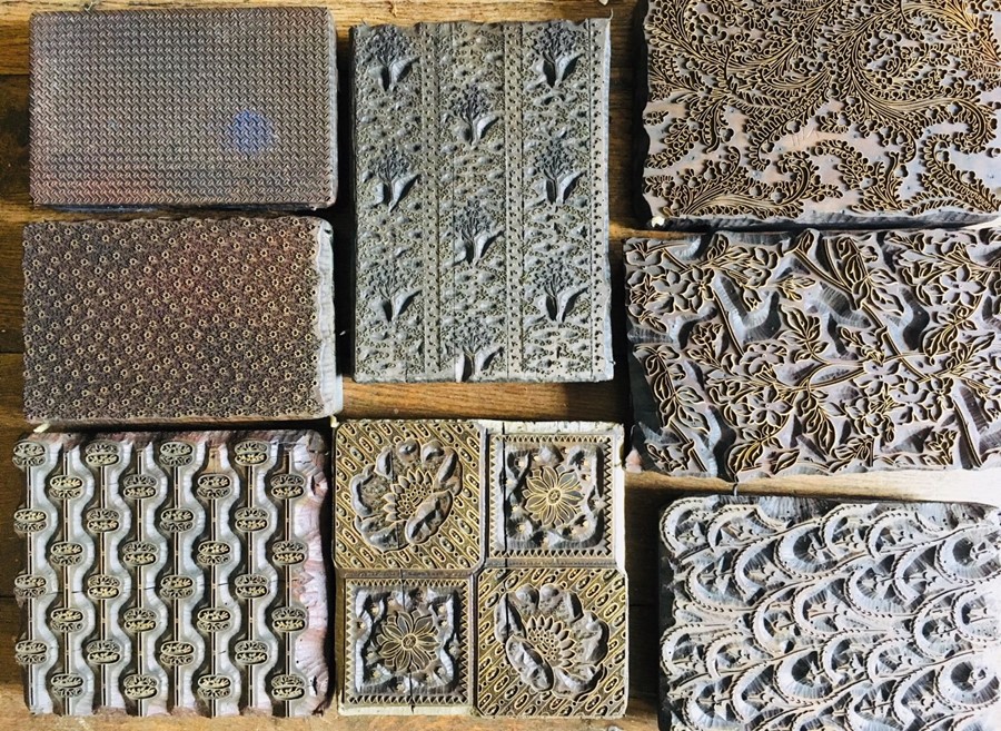 Collection of eight silk printing blocks, carved wooden and copper construction with handles, some