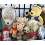 A collection of Winnie the Pooh Teddy Bears, other plush animals, Pooh collectables, jigsaws and a