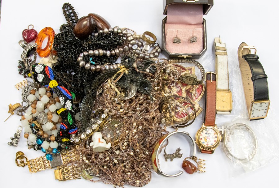 A collection of costume jewellery to include a Butler & Wilson gilt metal and red enamel heart and