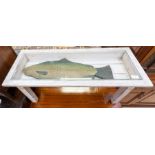 A 20th Century white painted coffee table, the glazed top inset with a wooden model of a trout