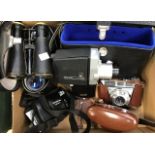 A collection of modern 20th Century binoculars, cameras plus others