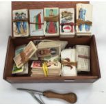 Small mahogany box with John Player and Sons collectors cards along with a rag doll and hunting fox