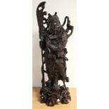 A 19th Century Chinese large carved hardwood figure of Guan Yu, with detachable sword, the figure