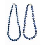 A Lapis Lazuli single strand bead necklace, fitted with 32 disc shaped beads, each individually hand
