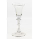 A George II baluster air twist stem English glass, 17cms high approx, slight chip to the base