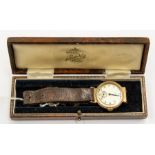 A 9ct gold Visible Swiss made gents wristwatch, round silvered dial, number markers and subsidiary