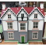 A handmade dolls house in the form of an Edwardian villa, mid-20th century, hinged opening,