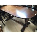 A Jacobean style oak dining table, of D ended form, raised on cup and cover turned supports, 77cm