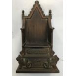 A cast iron money box in the form of a throne, by "Harper"