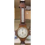 An early 20th Century James Moore of Derby mahogany barometer and thermometer, with hand carved