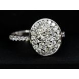 Rocks & Co - an 18k white gold and diamond cluster ring, size M1/2, gross weight approx 3.2gms,
