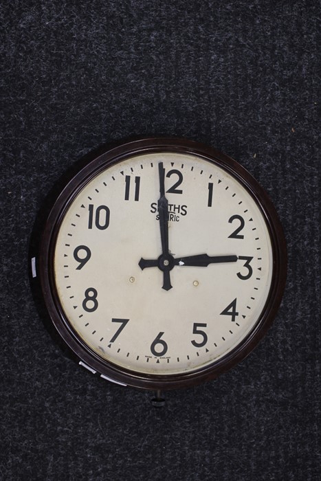 A Smiths sectric wall clock, with Arabic numerals, Bakelite case, 34cms diameter approx