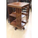 An Edwardian mahogany revolving bookcase, two tier form, 83cm high, 46cm wide, 46cm deep